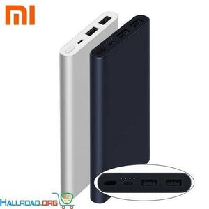 Xiaomi 10000mAh Mi Power Bank - shown in silver and dark blue, with a close-up of the top ports, including an input, output, and LED indicator lights.