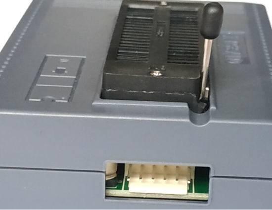 XP8710 Universal Professional Programmer With Over Current Protection - a close-up showing the grey plastic housing, the ZIF socket with a black lever, and a white connector port.