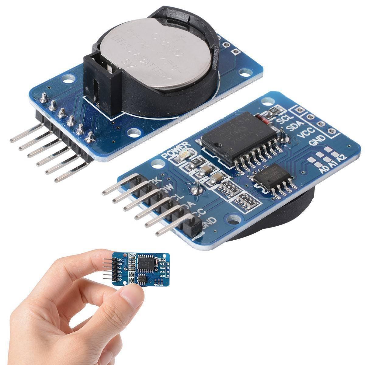 ZS 042 DS3231 Precision RTC Real Time Clock Module without cell - two blue circuit boards with pin headers, one with a battery and one held in a hand.