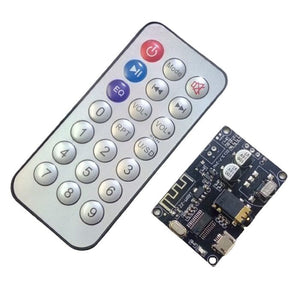 ZZ-WRBT BLUETOOTH 5.0 AUDIO RECEIVER MODULE wITH REMOTE - black circuit board, a 3.5mm audio jack, a micro USB port, and an accompanying silver remote control.