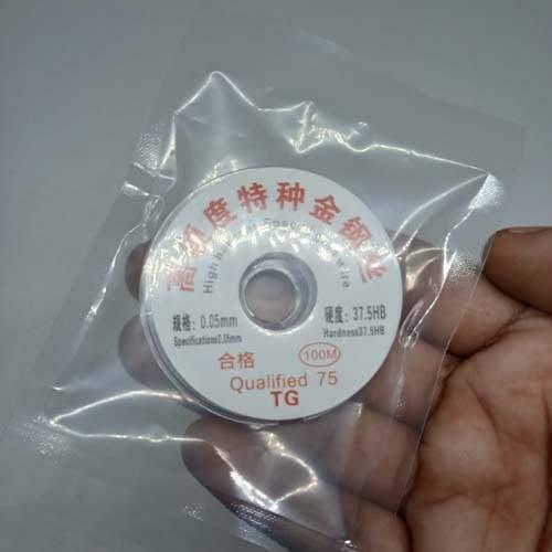 0.05 mm LCD Screen Separation High Hardness Special Gol Wire Cutting Line For Iphone Samsung Glass Wires Tools - a white spool of cutting wire in a clear plastic bag, showing specifications and hardness on its label.