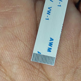 0.5-16P-120mm 0.5 Inch Pitch 16 Pin 120mm Leght Ffc Flexible Flat Cable - a close-up showing the white ribbon cable and its metallic connector pins.