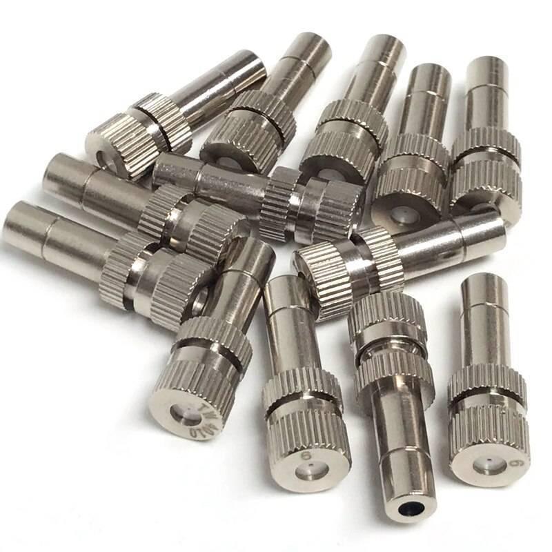 0.5mm Slip Lock Mist Nozzle For 6mm Quick Connector Spray - a pile of silver-coloured metal misting nozzles with slip-lock connectors.