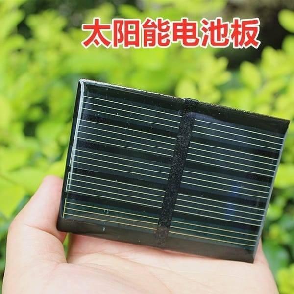 0.5V 100mA Solar Panel Cells Sun Power Charging Module For DIY Physical Science Experiment Photovoltaic - shown as a small, rectangular black solar panel with thin silver grid lines held in a hand.