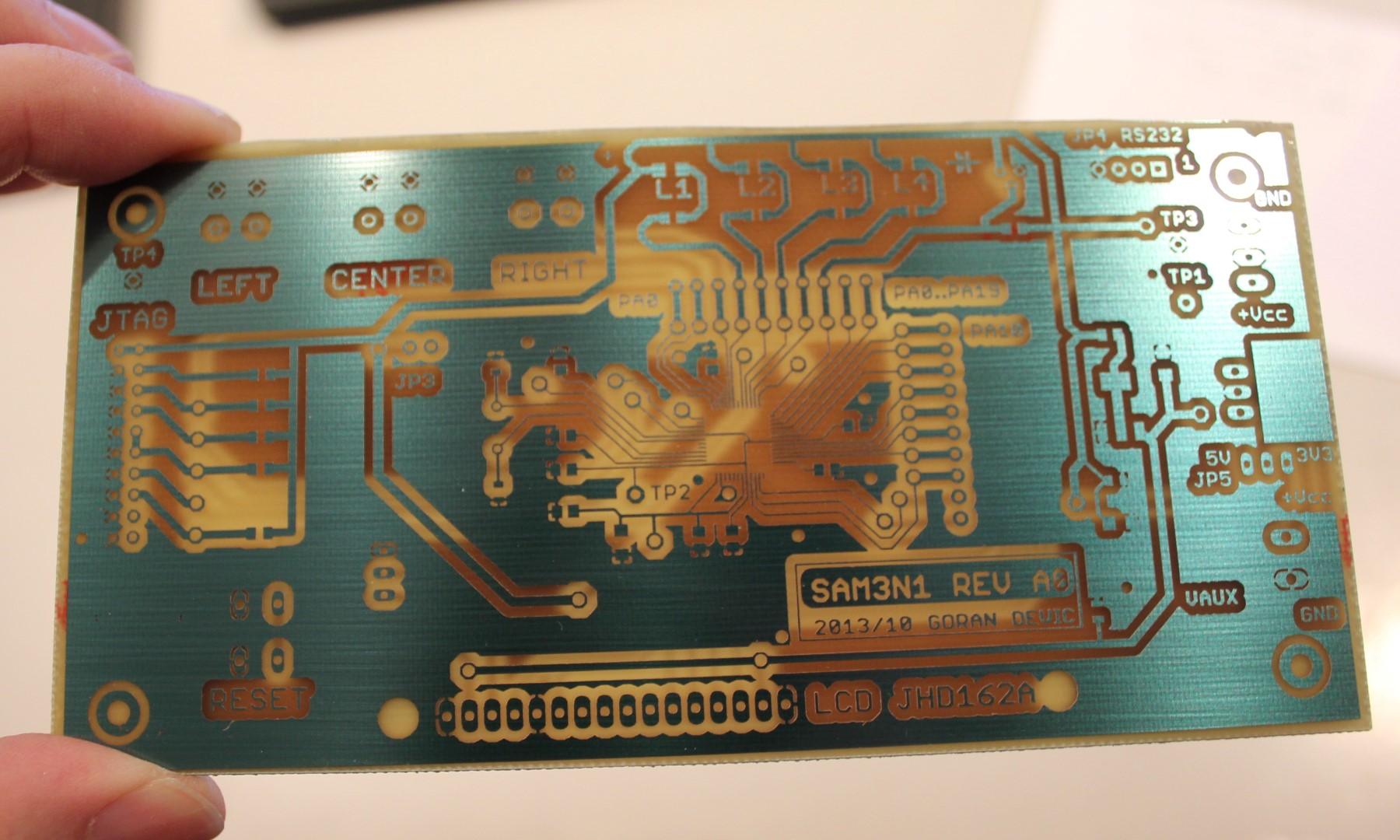 03214219864 Single Sided PCB Manufacturing PCB Prototyping Service - a green single-sided circuit board with copper traces, labeled SAM3N1 REV A9.