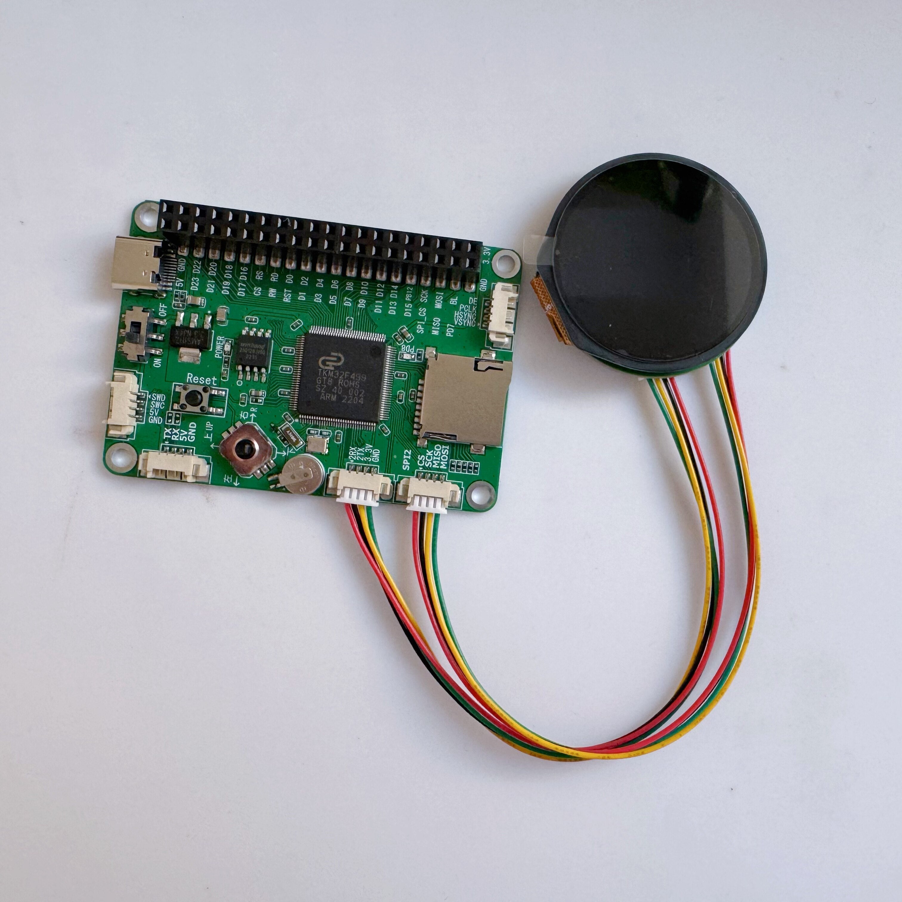 1.28 Inch IPS Round LCD Display Module With Capacitive Touch 2 Dupont Cables — ESP32 - — ESP32 showing a green circuit board connected to a round black display.