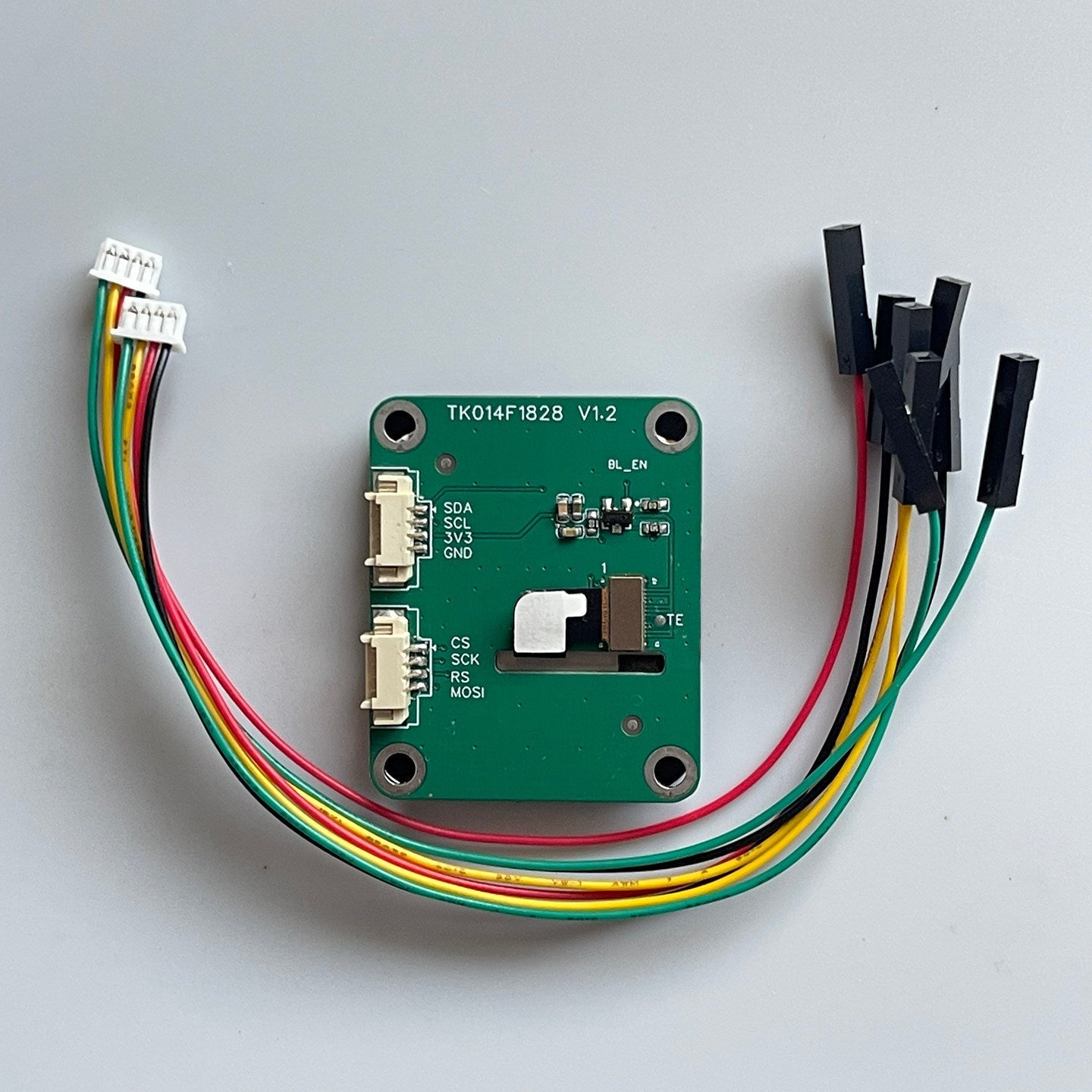 1.4-inch IPS Full-view LCD Screen ESP32 IOT Smartwatch 240x240 Square Capacitive Touchscreen - green circuit board with two white connectors, ribbon cables, and black jumper wire headers.