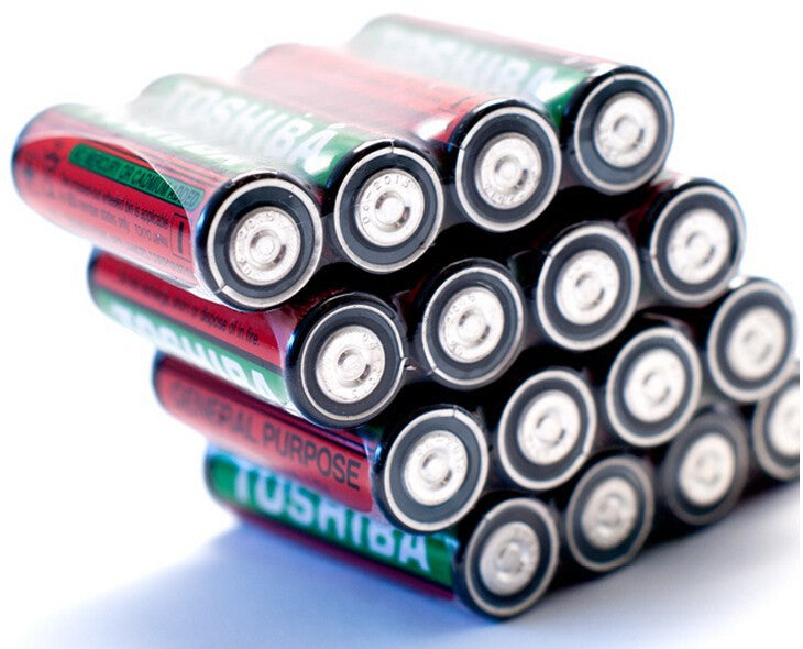 1.5V Non Rechargeable Cell AA Cell Camera Cell AA Clock Cell - stack of red and green Toshiba AA batteries arranged in a pyramid formation on a white background.