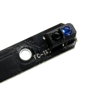 1 Channel Infrared Tracking Sensor Fc 123 Black And White Line Detection Sensor For Smart Car Tracing - a close-up showing a black circuit board with a blue LED and a black sensor component labeled TCPT5000.