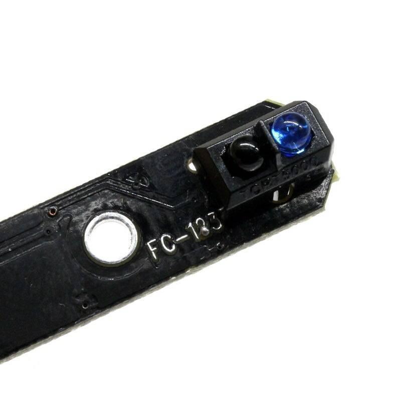 1 Channel Infrared Tracking Sensor Fc 123 Black And White Line Detection Sensor For Smart Car Tracing - a close-up showing a black circuit board with a blue LED and a black sensor component labeled TCPT5000.