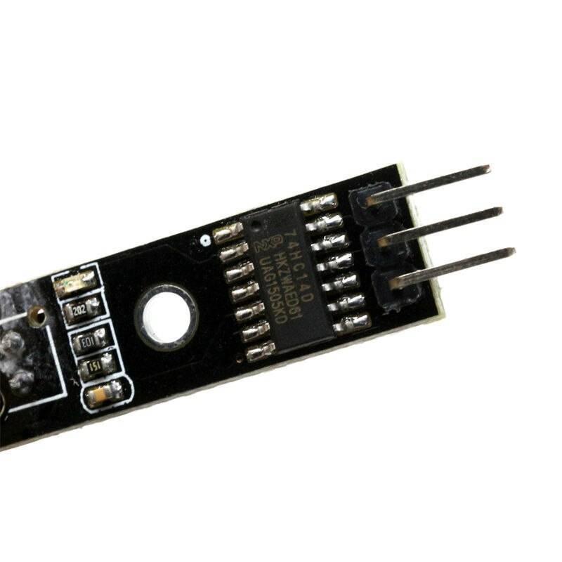 1 Channel Infrared Tracking Sensor Fc 123 Black And White Line Detection Sensor For Smart Car Tracing - a close-up of a black circuit board featuring a 74HC14D chip, surface-mount resistors, and a three-pin connector.