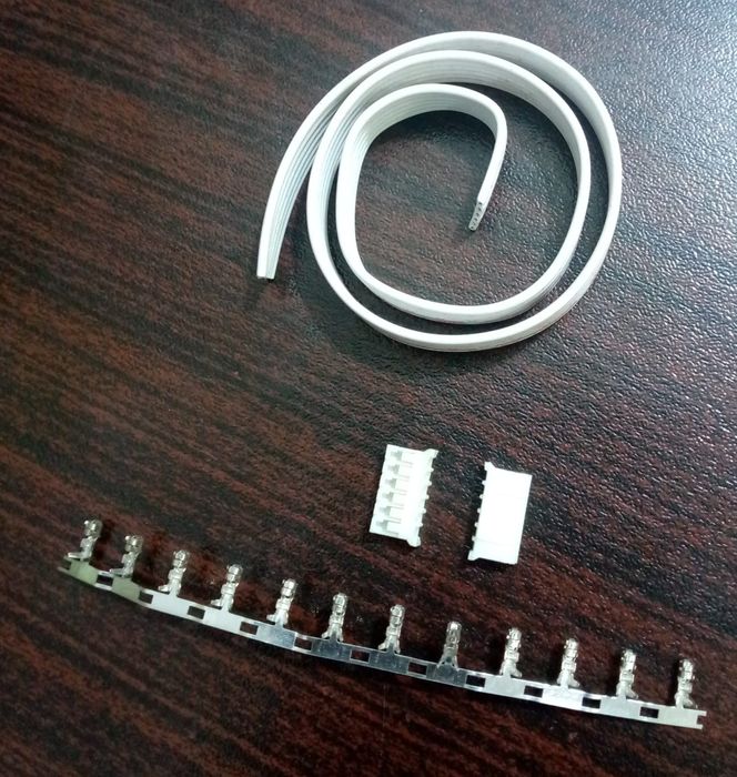 1 Feet 2mm 6 Pin Wire And Connector - a white ribbon cable, two 6-pin plastic connector housings, and a strip of metal crimp terminals.