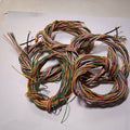 1 Meter 10pcs Hard Jumper Wires 100cm Spiral Wrap Wires 10 Core Cable - shown as a tangled bundle of multi-coloured wires coiled on a white surface.