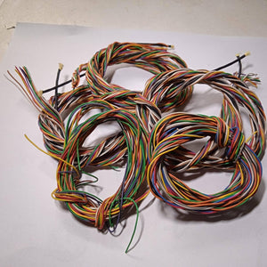 1 Meter 10pcs Hard Jumper Wires 100cm Spiral Wrap Wires 10 Core Cable - shown as a tangled bundle of multi-coloured wires coiled on a white surface.