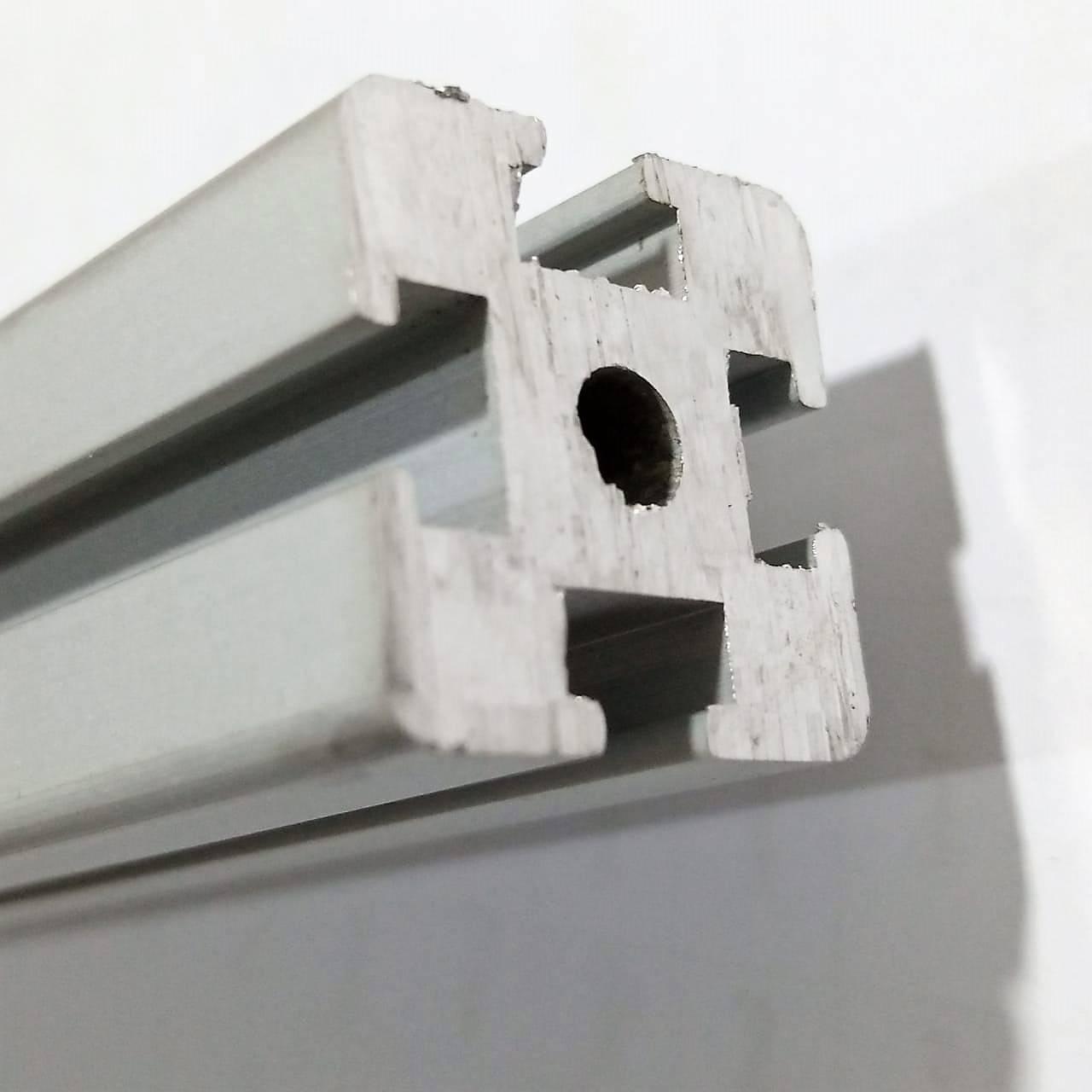 1 Meter 2020 Aluminum Profile Aluminium Extrusion For CNC And 3d Printer - a close-up view of the silver metal extrusion showing its square cross-section with T-slots and a central circular hole.