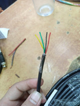 1 Meter 4 Core Signal Cable Sensor Cable - a close-up of the stripped black outer jacket revealing four internal wires colored yellow, green, black, and red.