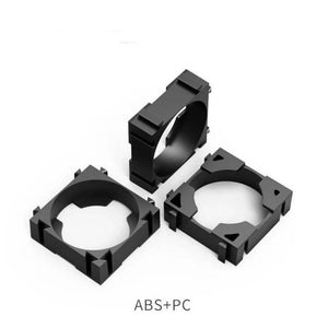 1 Piece 18650 Lithium Cell Battery Holder Bracket - three black plastic square-shaped battery spacer brackets arranged in a group.