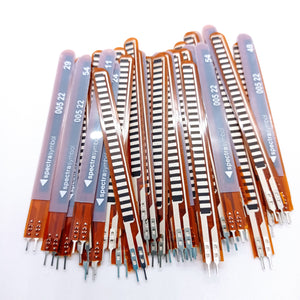 1 Piece 2.2 Inch Flex Sensor Bend Detection Sensor - a pile of thin, orange, flexible strips with black sensor patterns and two-pin connectors at the base.