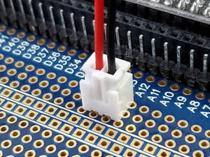 1 Piece 2.54mm Pitch JST2.54 Plug 2 Pin Extension Wire Connector - shown as a white plastic two-pin connector with red and black wires plugged into a blue circuit board.