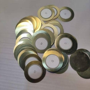1 Piece 27mm Piezoelectric Transducers Piezoelectric Sensor , Piezo Transducer - a pile of circular gold-coloured metal discs with white ceramic centers marked with an S.