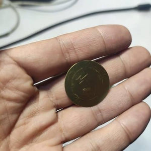 1 Piece 27mm Piezoelectric Transducers Piezoelectric Sensor , Piezo Transducer - a close-up of a circular, gold-coloured metal sensor held in a person's palm.