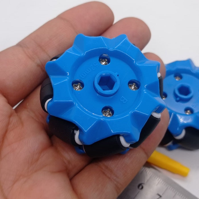 1 Piece 52mm Mecanum Omni Wheels Tires For DIY Rc Robot Toys Tt Motors - a close-up of a blue plastic wheel with black rollers held in a hand.
