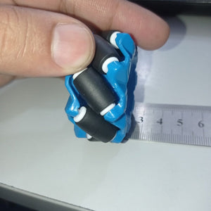 1 Piece 52mm Mecanum Omni Wheels Tires For DIY Rc Robot Toys Tt Motors - a close-up of the blue plastic frame and black rubber rollers being measured against a metal ruler.