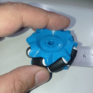 1 Piece 52mm Mecanum Omni Wheels Tires For DIY Rc Robot Toys Tt Motors - a blue wheel with black rollers being measured against a ruler.