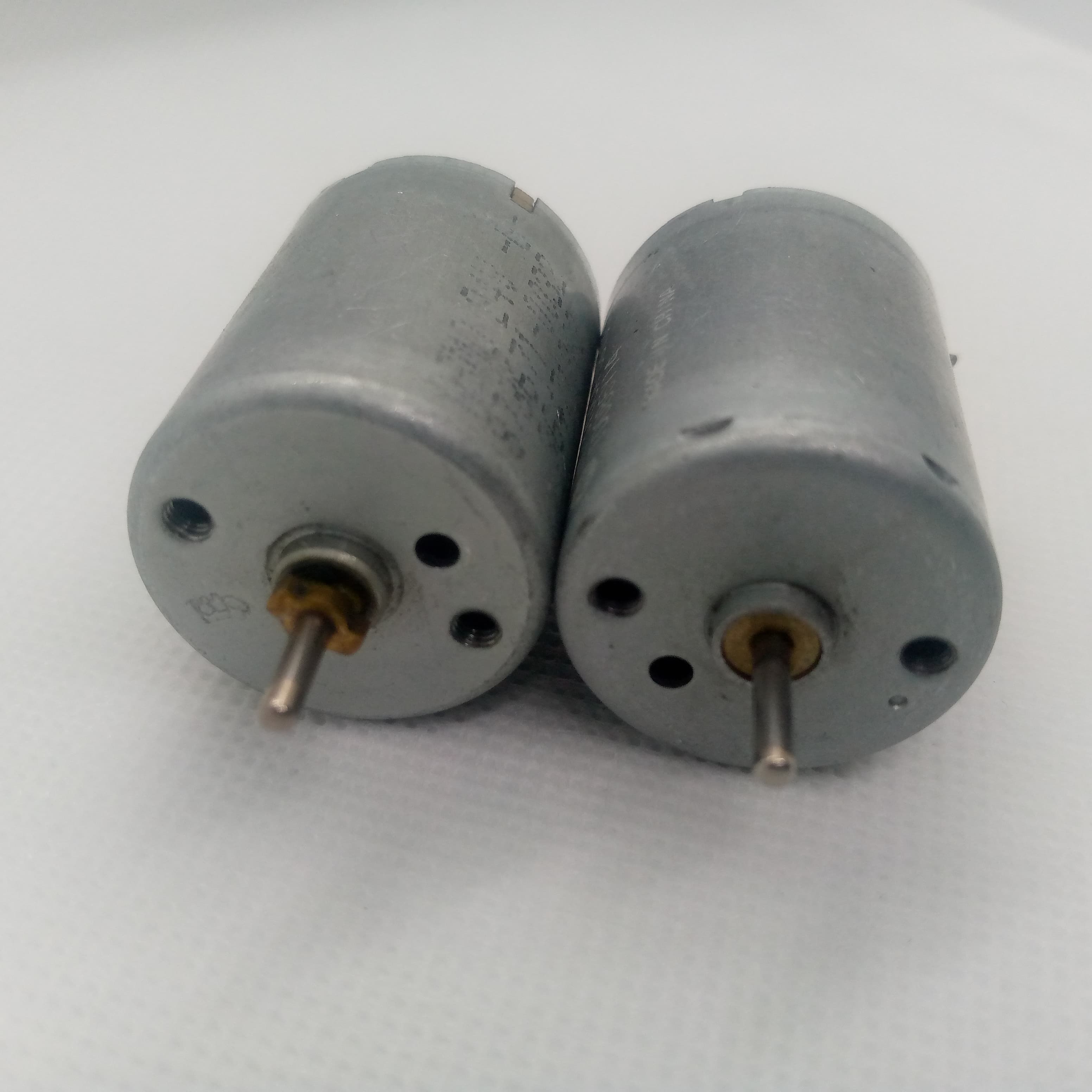 1 Piece DC 2V To 24V 8960RPM High Torque Mini Micro Motor DC Motor - two silver cylindrical DC motors with metal shafts positioned side-by-side on a white surface.