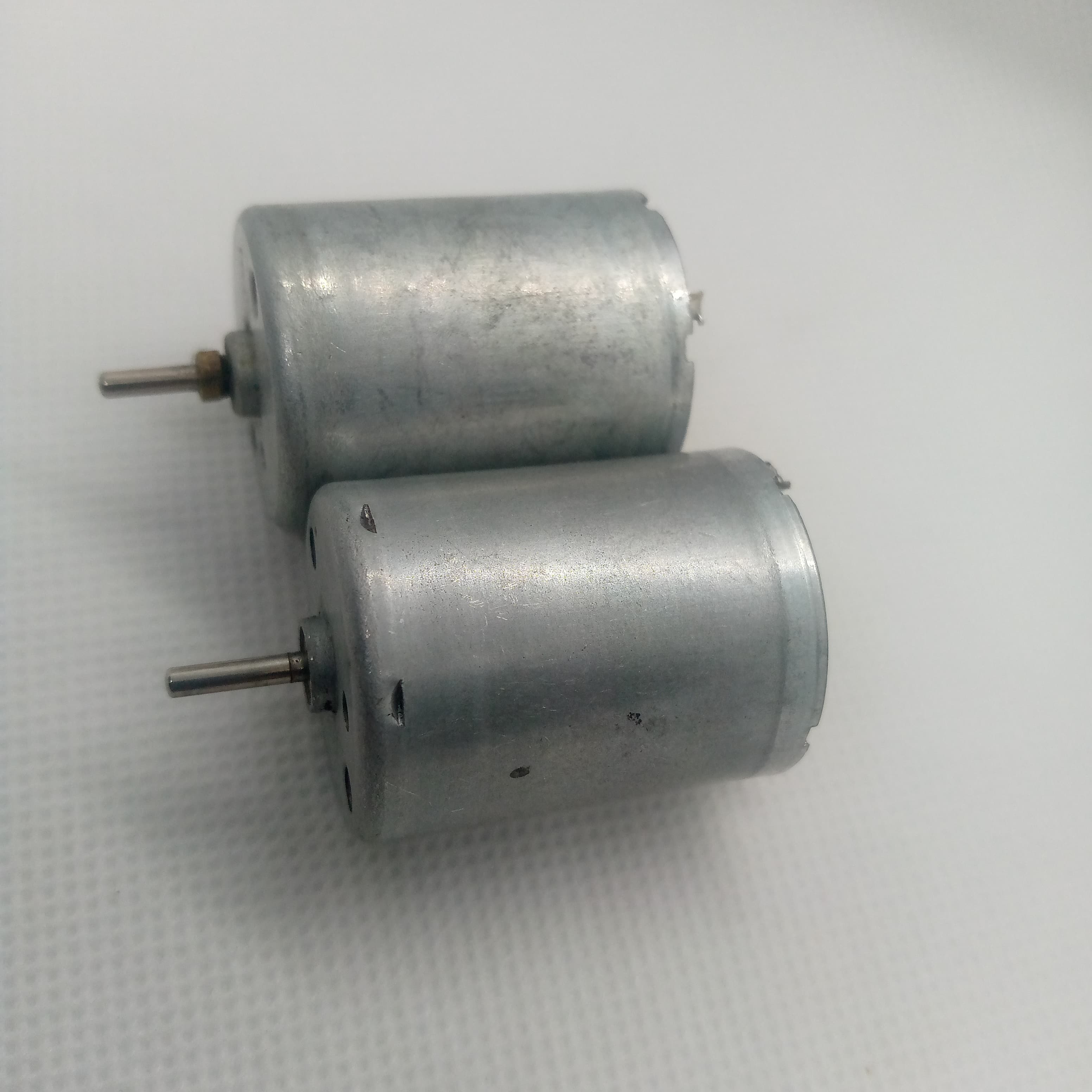 1 Piece DC 2V To 24V 8960RPM High Torque Mini Micro Motor DC Motor - two silver cylindrical DC motors with protruding metal shafts on a white background.