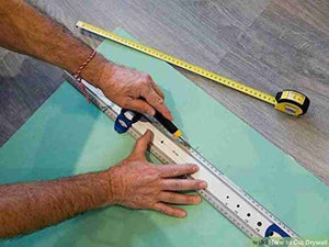 1 Piece Multifunction Utility Sharp Blade Snap Off Retractable Paper Knife Cutter - with a metal ruler to score a green drywall sheet.