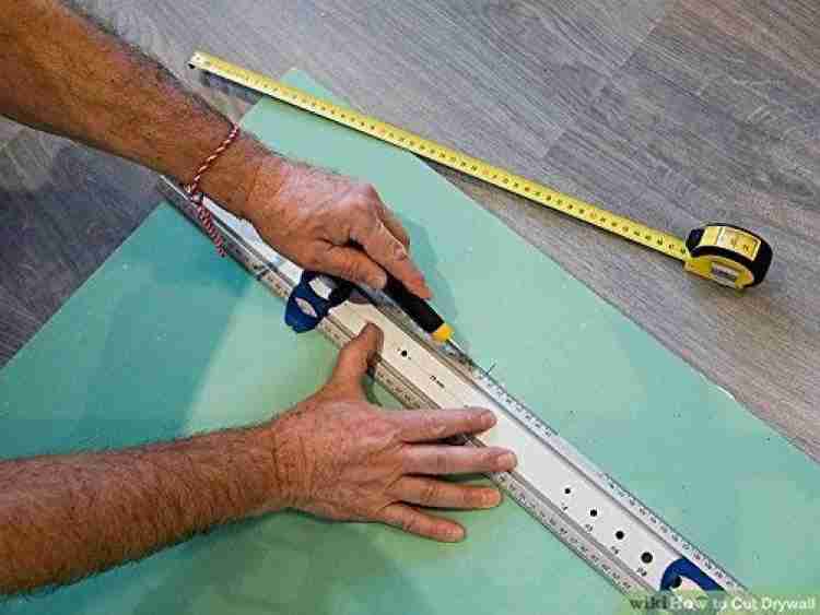 1 Piece Multifunction Utility Sharp Blade Snap Off Retractable Paper Knife Cutter - with a metal ruler to score a green drywall sheet.