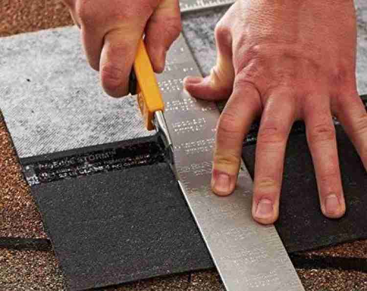 1 Piece Multifunction Utility Sharp Blade Snap Off Retractable Paper Knife Cutter - shown in yellow being used with a metal ruler to cut roofing material.