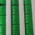 1 Piece Ni Mh 3.6V 60mA Rechargeable Battery - shown as a bulk pack of green cylindrical batteries arranged in white foam packaging.