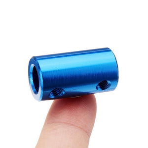 1 Piece Rigid Shaft Coupler 8x8mm 8mm To 8mm Bore Rigid Coupling Set Screw L25XD14 Aluminum Alloy Shaft Coupler - a blue cylindrical aluminum alloy coupling held by a finger, featuring two visible threaded set screw holes.