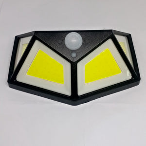 100 LED 4 Surface Solar Light 3 Modes 120 Degree PIR Motion Sensor Light - a black, angular solar wall light with two yellow LED panels and a sensor.