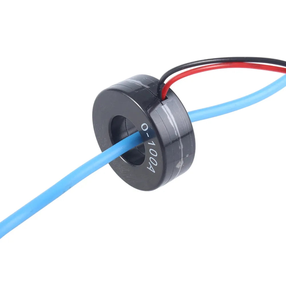 100A AC Current Transformer Ct For Mini Ammeter Current Meter - a black ring-shaped sensor with red and black output wires and a blue cable passing through its center hole.