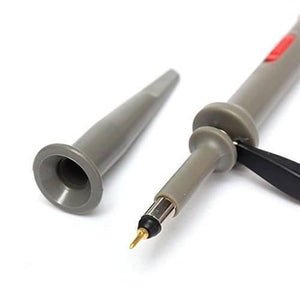 100MHz Oscilloscope Scope Clip Probes P6100 - a close-up of a grey probe tip with a gold pin, a detachable grey cap, and a black ground clip.