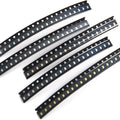 100pcs SMD 0805 LED SMT LED Light Diode - shown as five strips of small, rectangular surface-mount LED components arranged in black carrier tape.