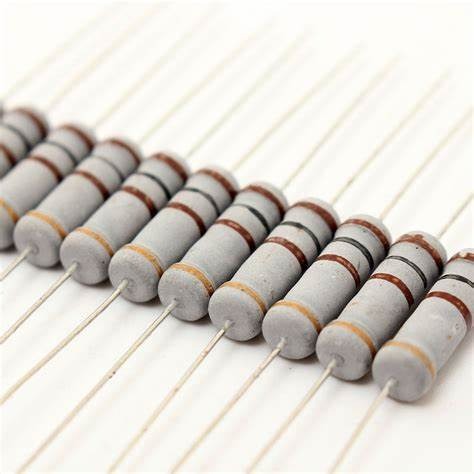 100R 2W 5% Resistance Metal Axial Oxide - shown in a close-up, angled row of grey cylindrical components with brown and black color bands.