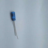 100uF 6.3V Electrolytic Capacitor - shown as a single blue cylindrical electronic component with two wire leads extending from the bottom.