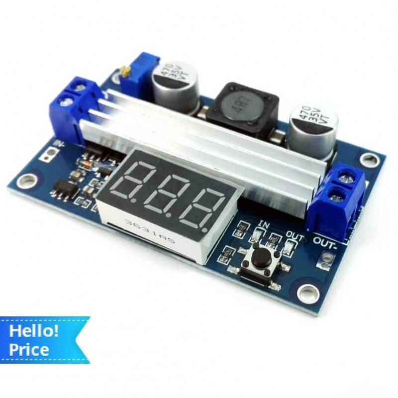 100W Adjustable DC Boost Converter With Display - blue circuit board featuring a silver heatsink, a digital LED screen, screw terminals, and a button.