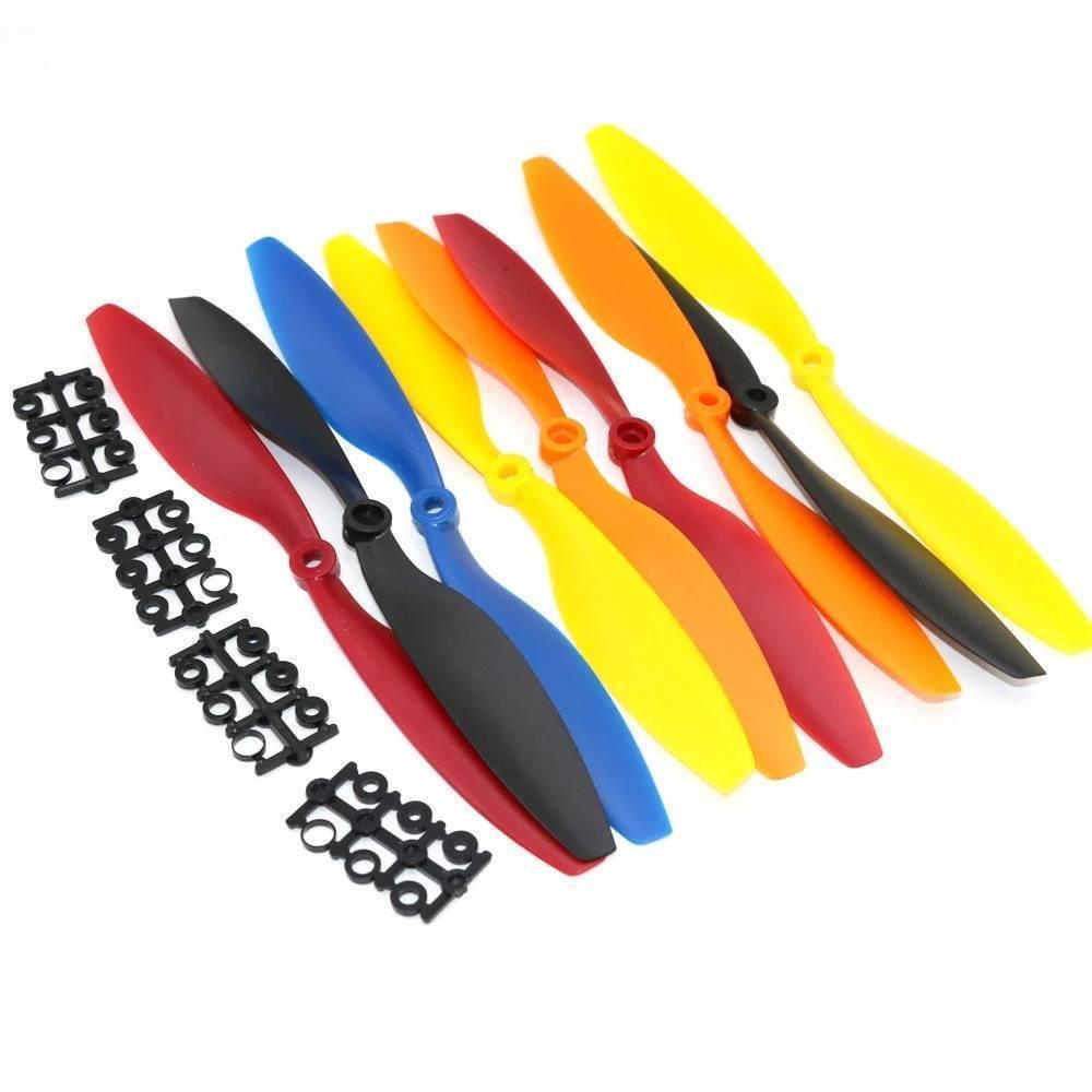 1045 Multiaxial Cw Ccw ABS Blade Propellers In Different Colors - an assortment of red, black, blue, yellow, and orange blades with black adapters.