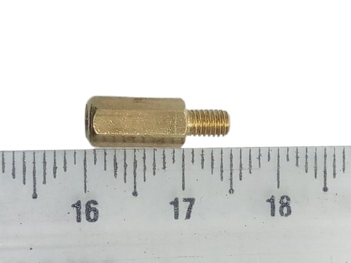 10mm+5mm M3 Male To Female PCB Spacer Brass PCB Standoff - shown in a close-up view positioned above a ruler to indicate its length.