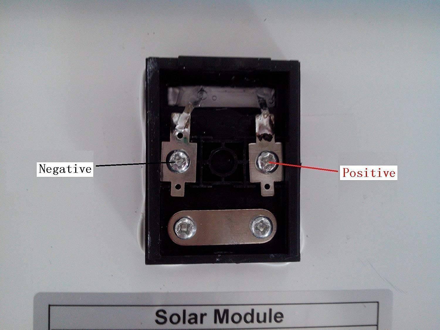 10W Solar Panel 18 Volt PV Solar Module Solar Cell Panel - close-up of the black plastic junction box showing the labeled negative and positive screw terminals.