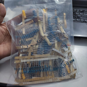 1100pcs Of Different Values 1% Resistors 20pcs Each Value - shown in a clear plastic bag containing multiple strips of blue axial resistors with tape.
