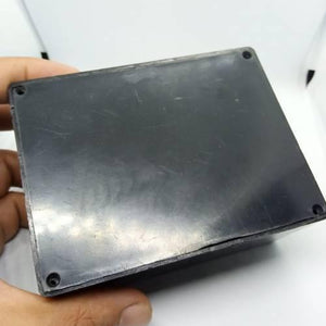 115mm x 90mm x 53mm ABS Electronics Enclosures Box Project Box - a top-down view of the black rectangular plastic enclosure with corner screw holes.