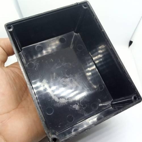 115mm x 90mm x 53mm ABS Electronics Enclosures Box Project Box - shown as an empty, rectangular black plastic casing held in a hand.