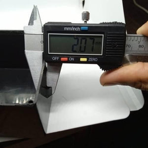 115mm x 90mm x 53mm ABS Electronics Enclosures Box Project Box - a digital caliper measuring the thickness of the black plastic wall as 2.07 mm.