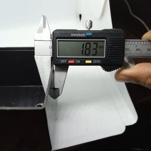 115mm x 90mm x 53mm ABS Electronics Enclosures Box Project Box - a close-up measurement of the black plastic wall thickness at 1.83mm using digital calipers.